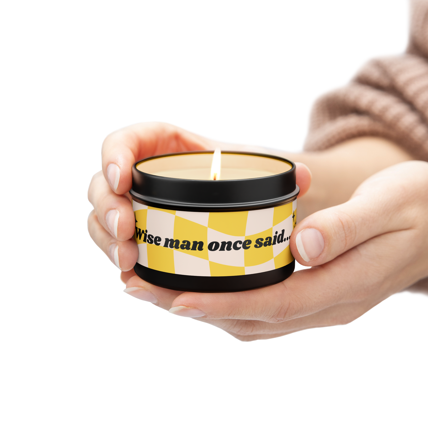 Scented candle, eco friendly, natural wax, in black tin. Design is yellow and white checkered flag background, text that reads: "Wise man once said..." and black and gold twinkle stars at both ends. 5 scent options.