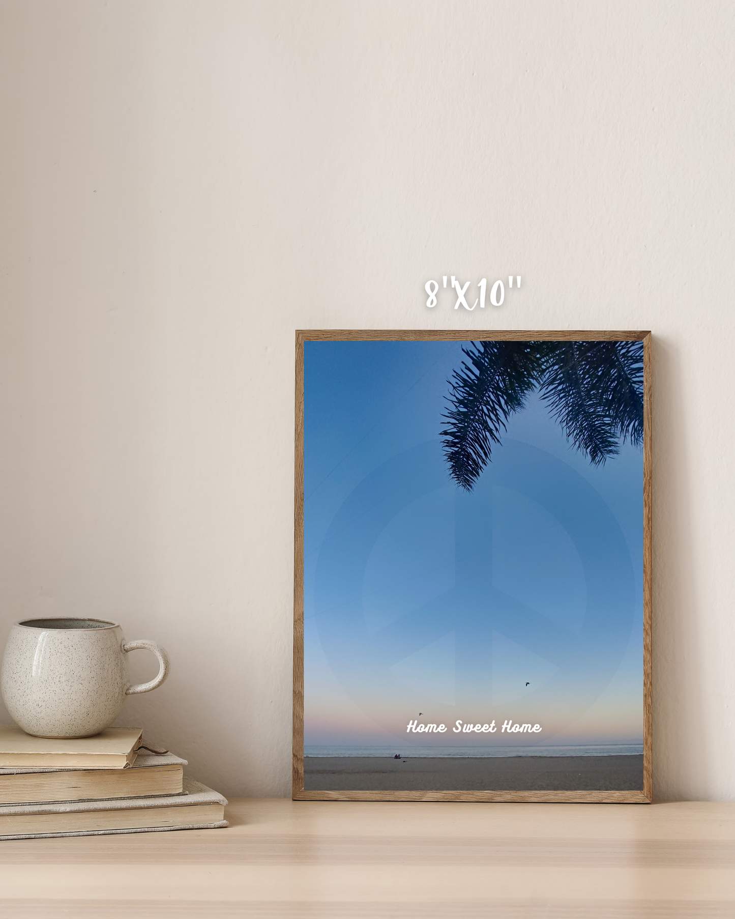 canvas print sunset beach scene with palm trees and peace sign blending in with home decor