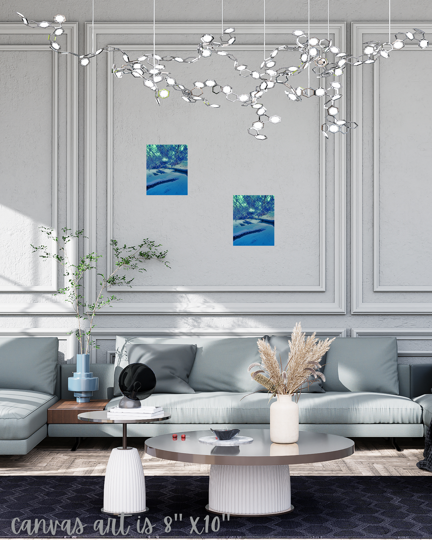 Contemporary living room with blue and gray hues crown moulding and winter themed art in frozen creekbed