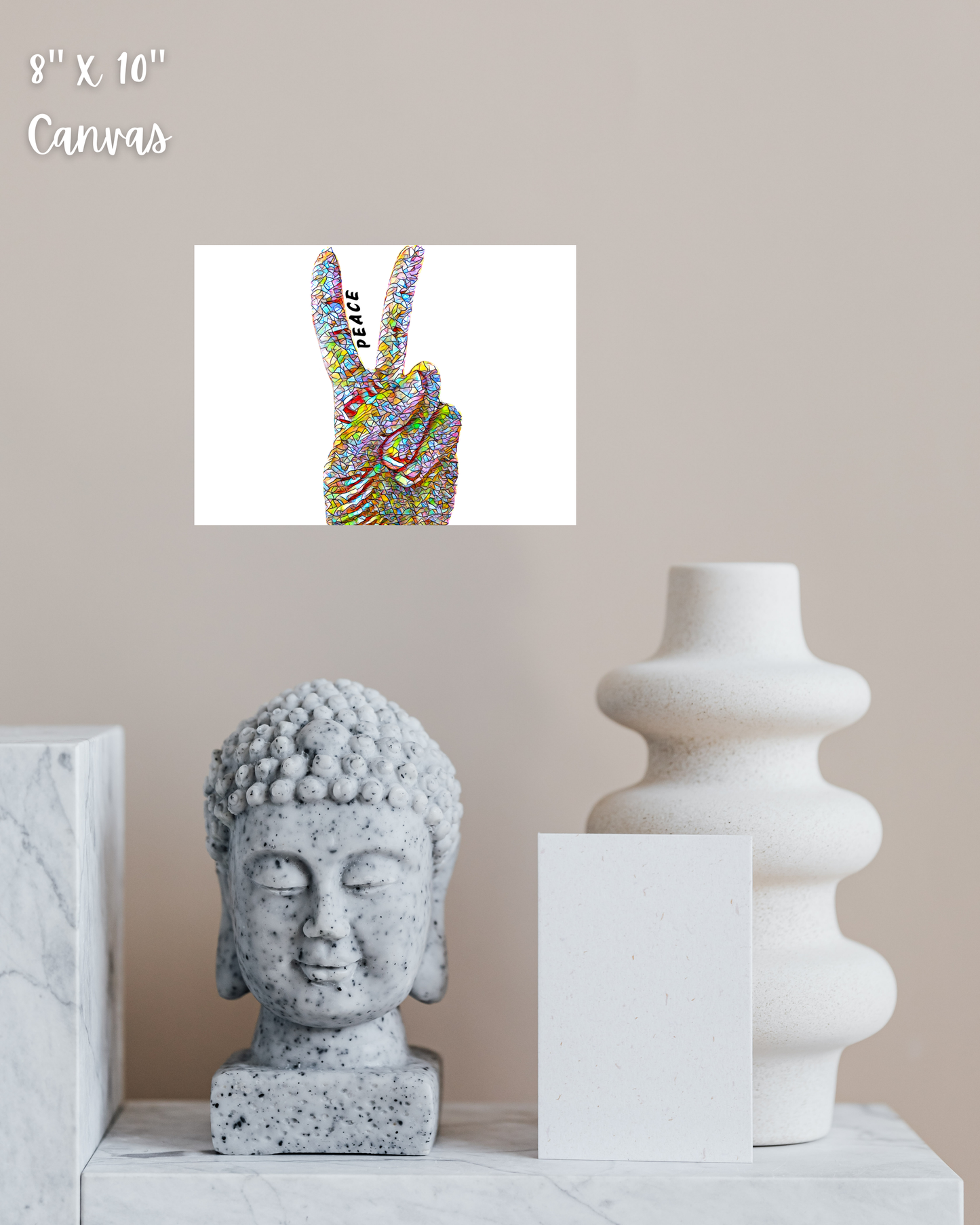 colorful abstract peace sign art print hanging with marble room decor and buddha statue