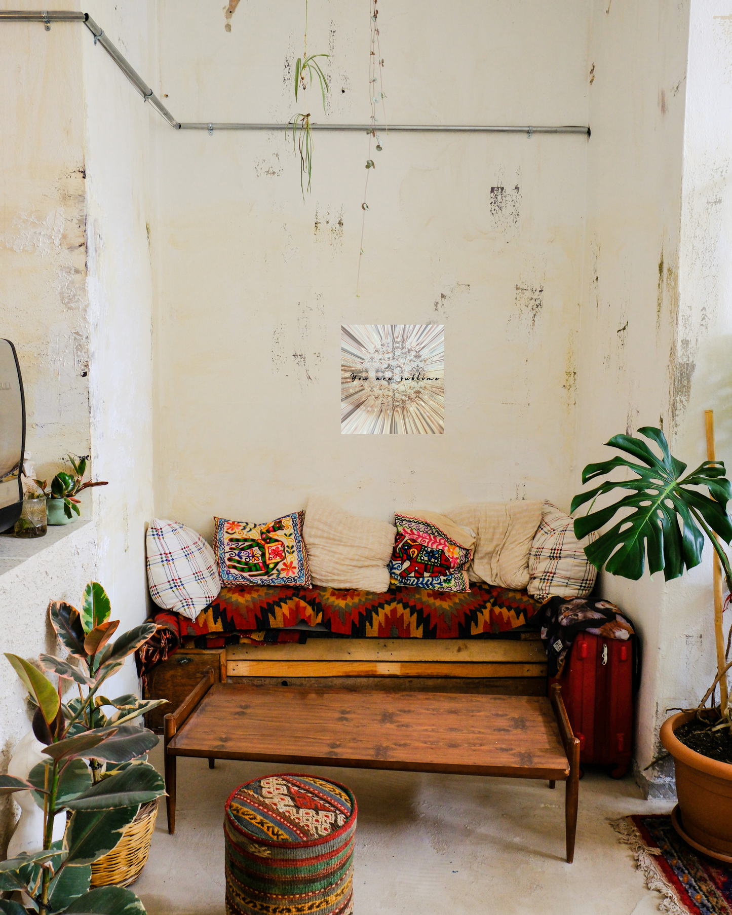 Cozy southwestern boho style living room with art that blends yet juxtaposes with glamour sublime floral design and words of encouragemnt