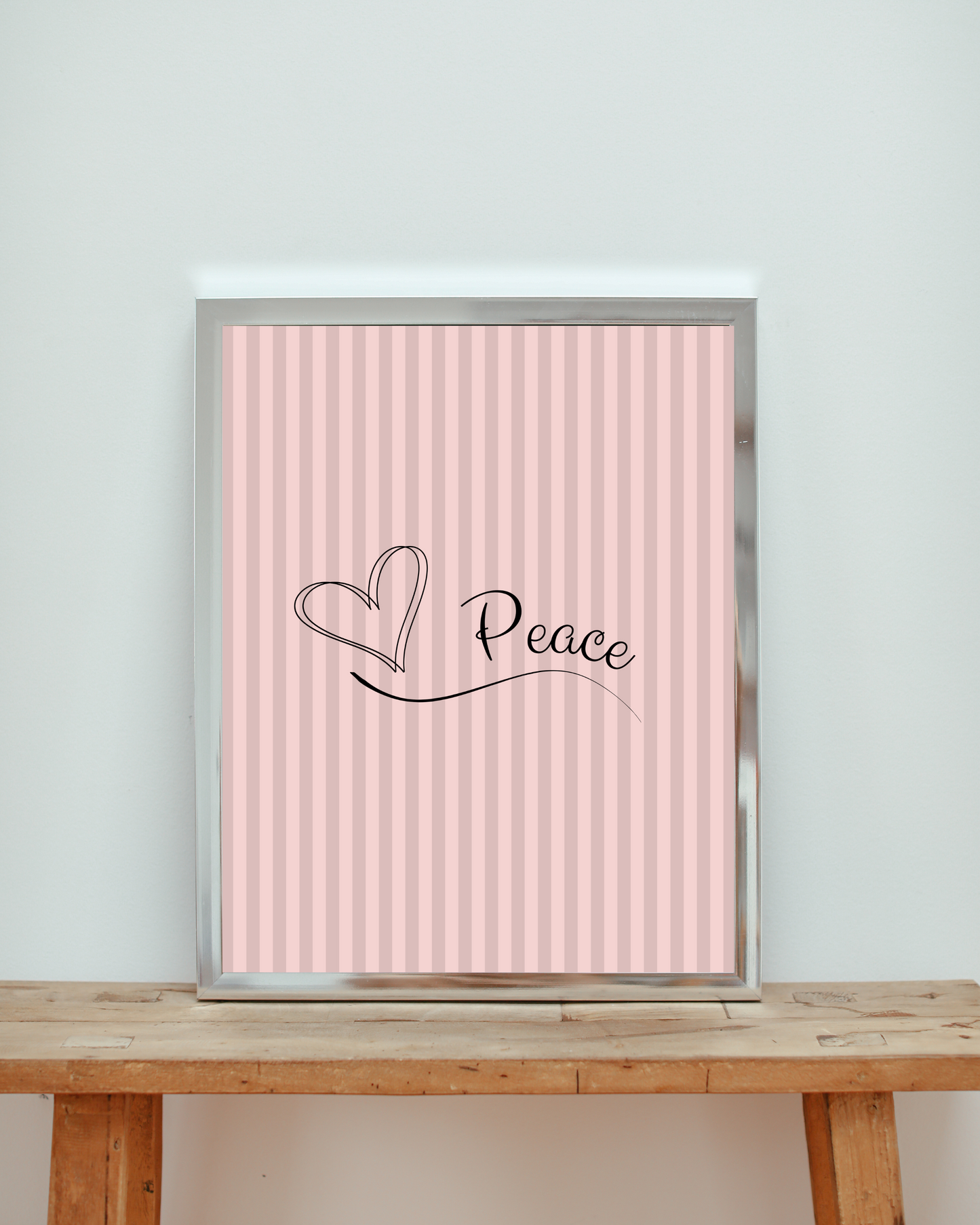 Canvas art print with 'Peace' and heart design on a light pink striped background