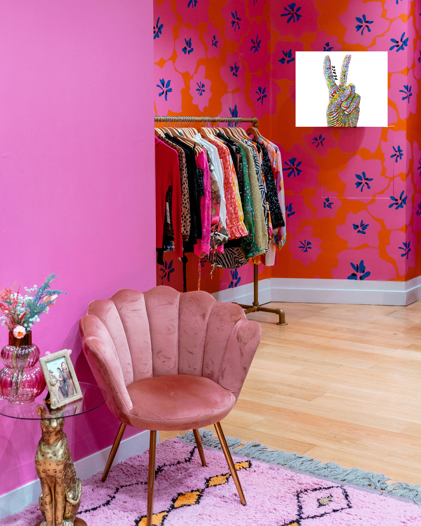 colorful hollywood glam room with boho eclectic influences and vibrant peace sign hand wall art full of color and peaceful vibes