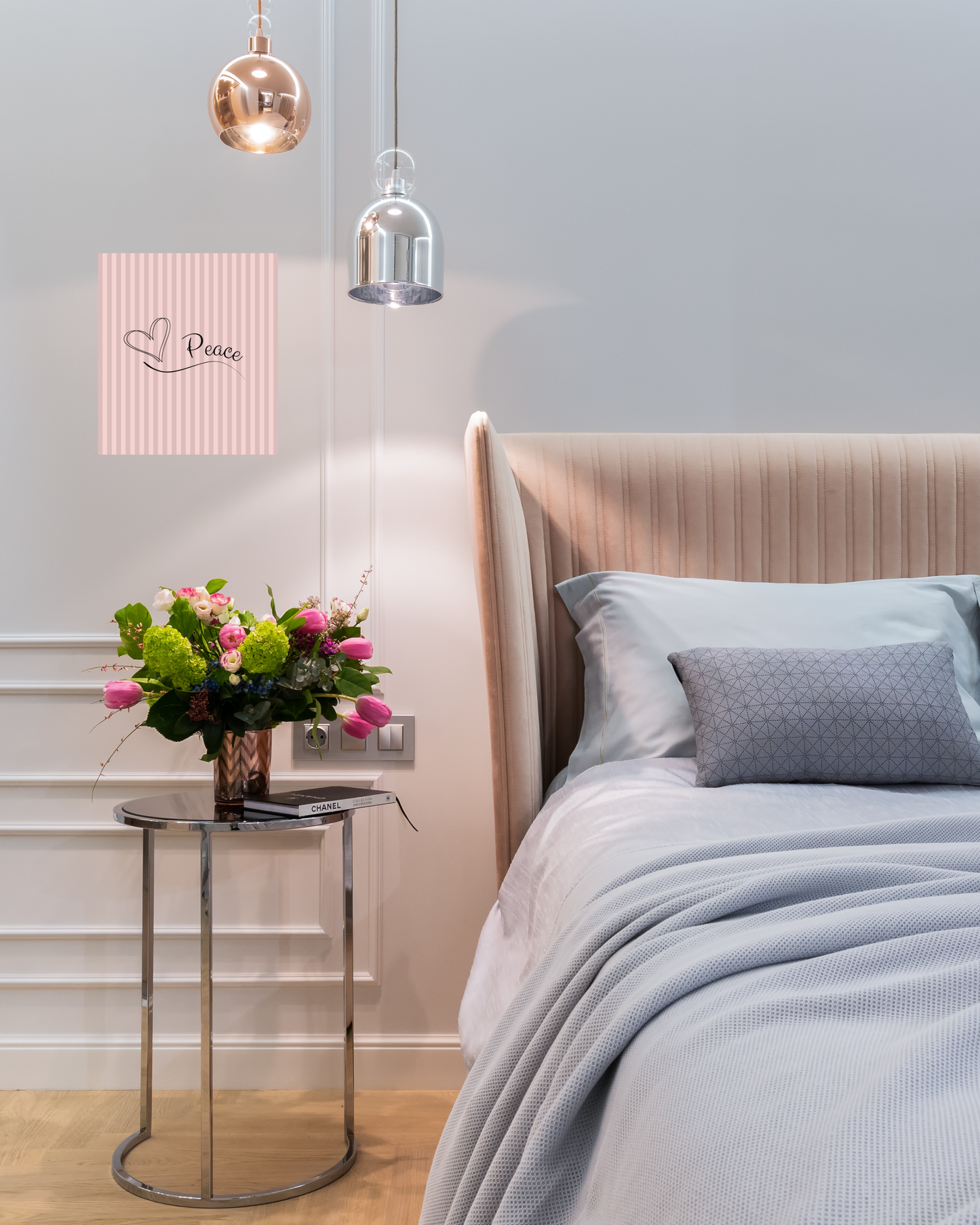Warm contemporary bedroom with classic gray and pink striped canvas art with simple peace design