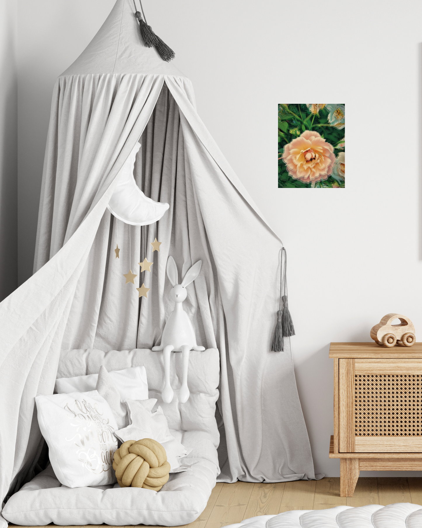 young child's play room with a canopy bed, stuffed animals, and pretty pink wall art of a rose flower