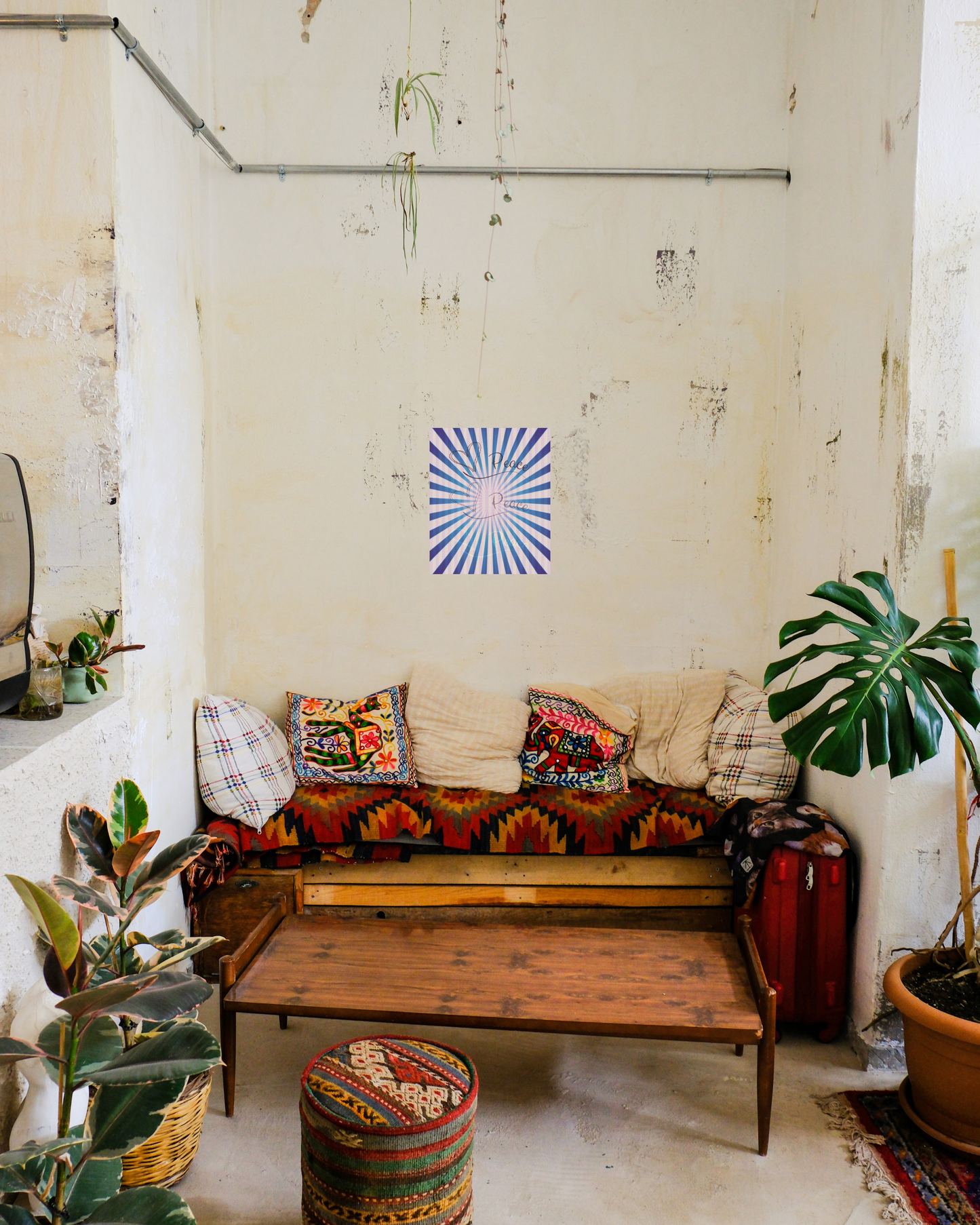 boho southwestern style room with cozy sofa, plants, and vibrant purple peace canvas print