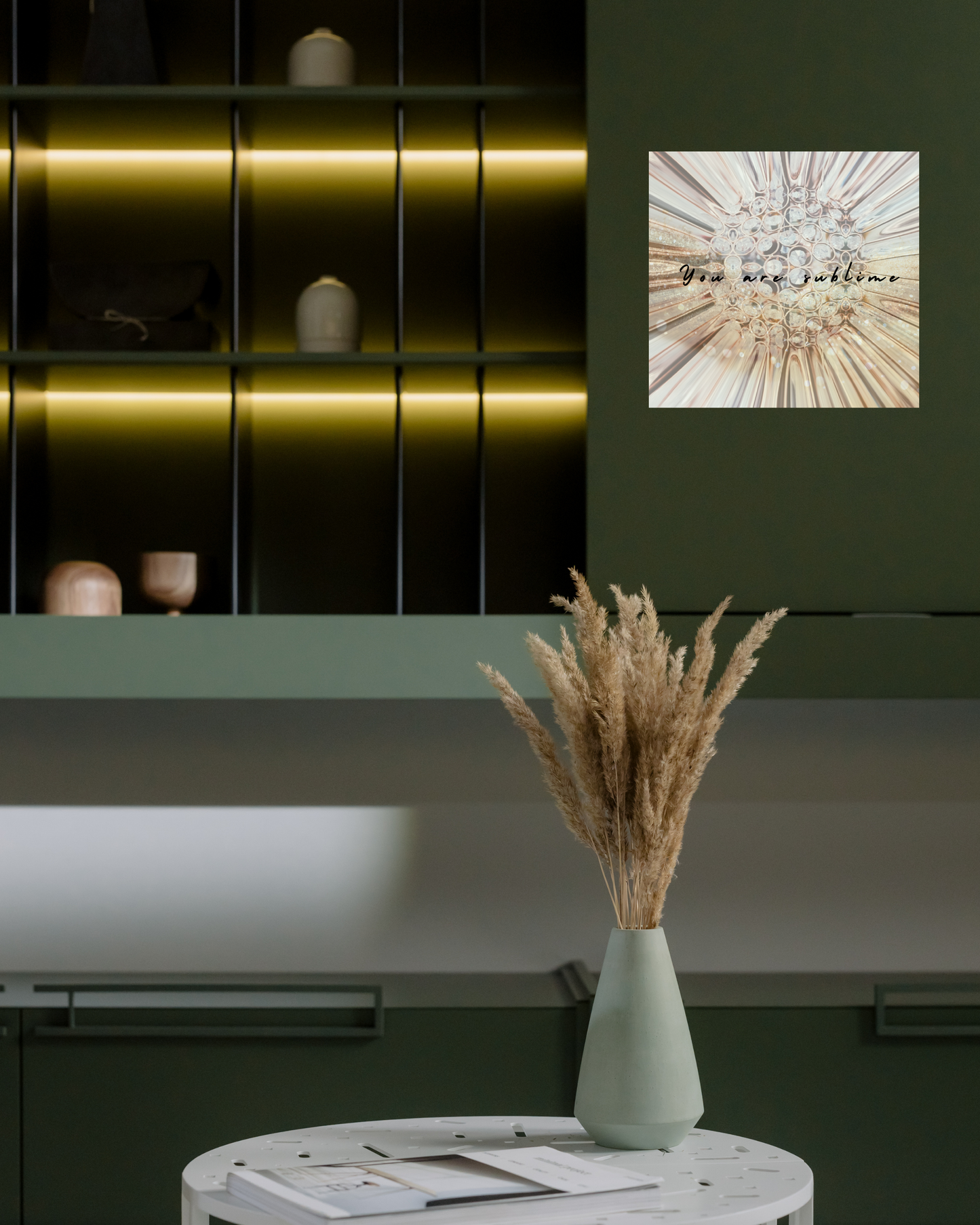 clean modern interior with green hues and dark colors. gold and diamond floral wall print lights up the room