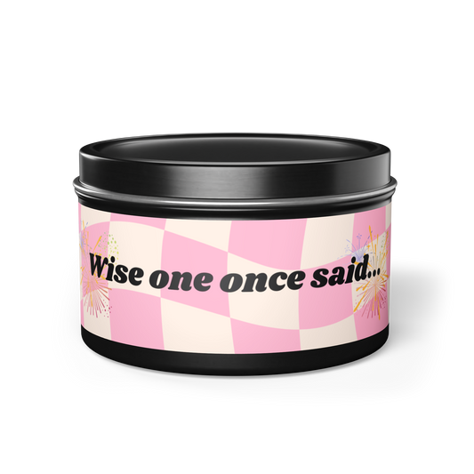 black container candle with 5 scent options. pink checkered flag design with 'wise one once said' wisdom message.
