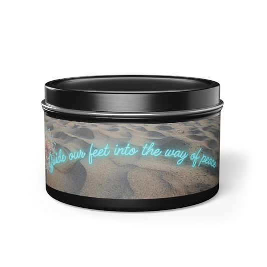 Black steel tin candle with natural wax, 5 refreshing scent options. Original sand beach design with neon 'guide our feet into the way of peace' message.