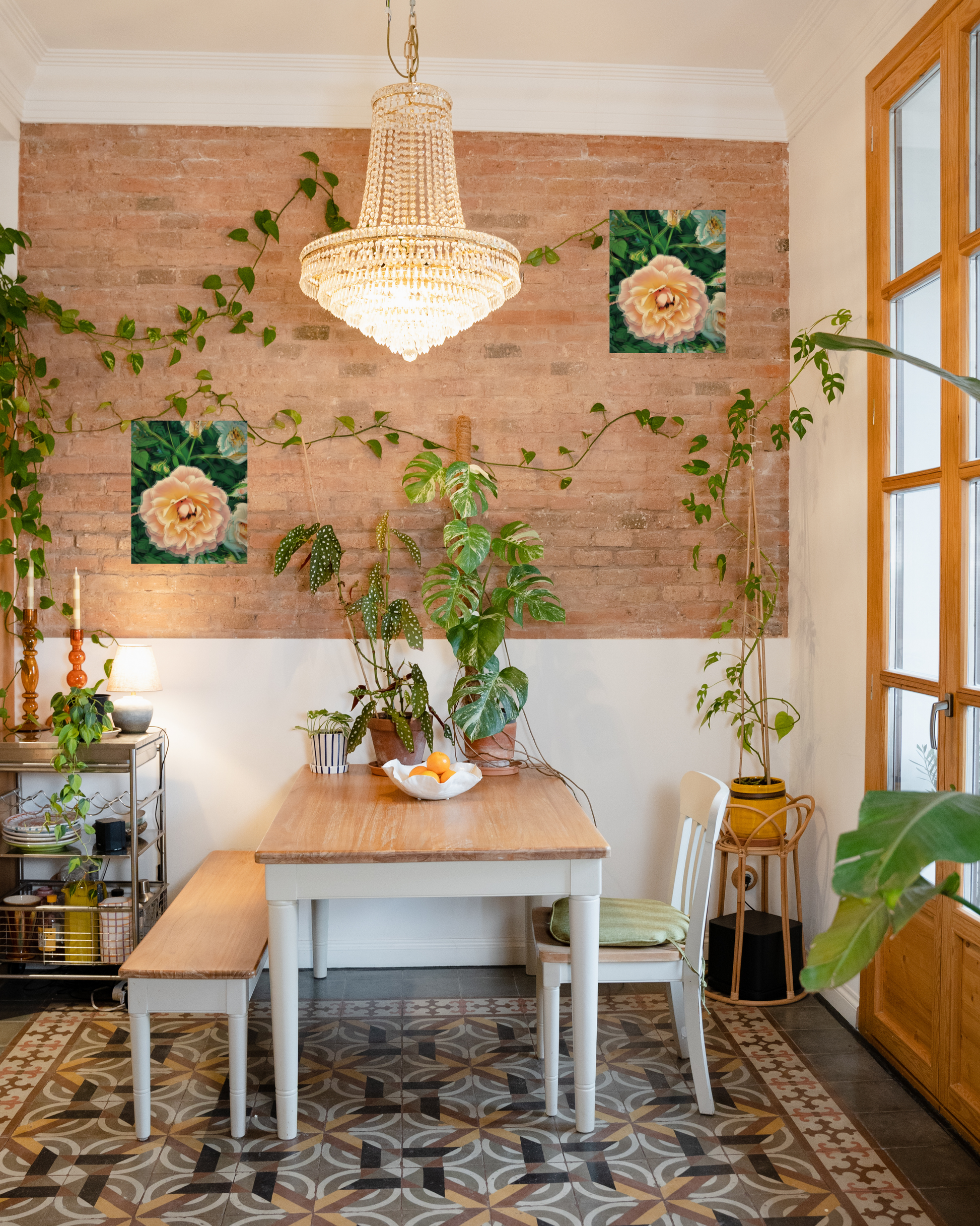 upgraded contemporary dining room with brick wall elegant lighting natural tones and pink rose wall art to match plants