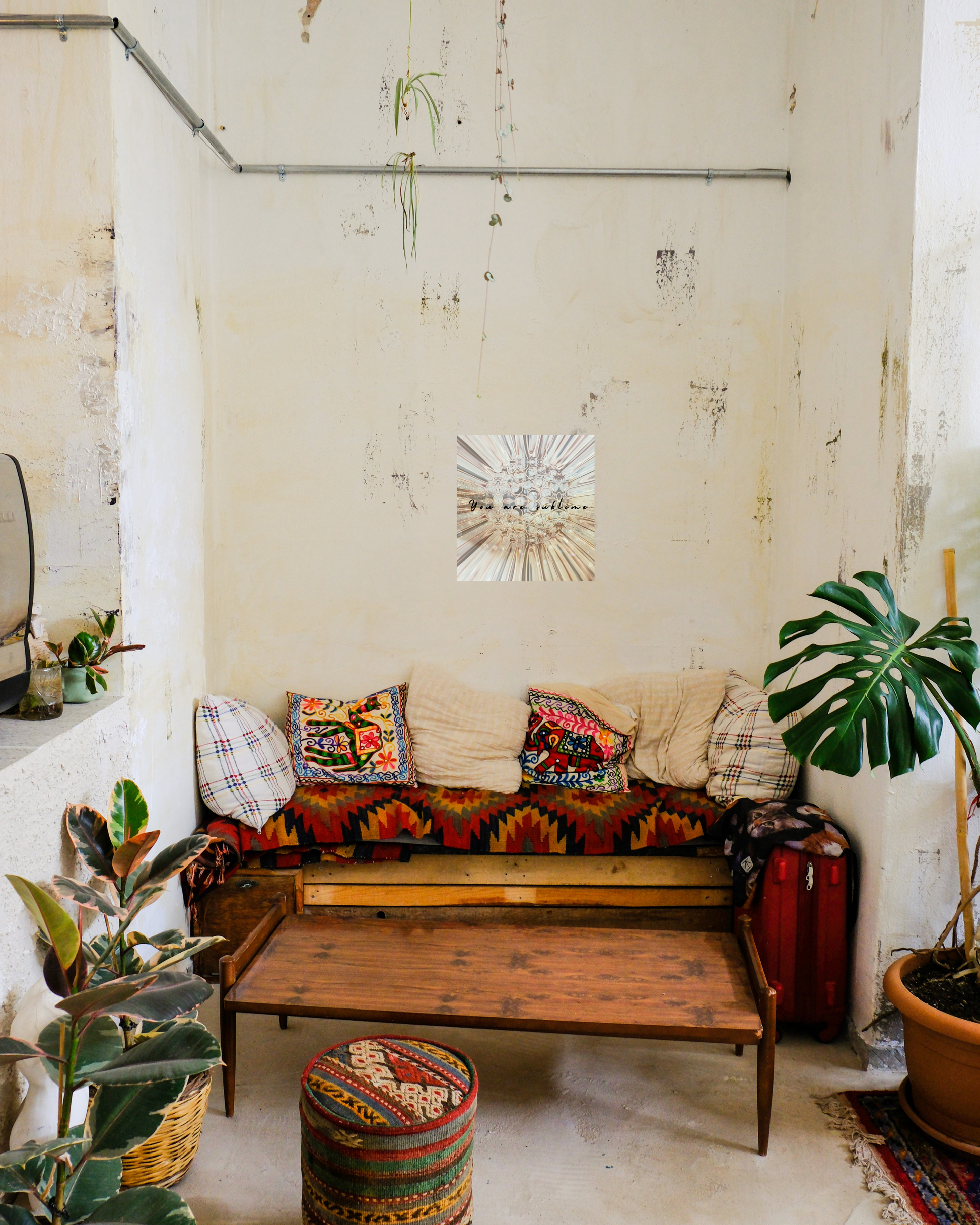 Cozy southwestern boho style living room with art that blends yet juxtaposes with glamour sublime floral design and words of encouragemnt