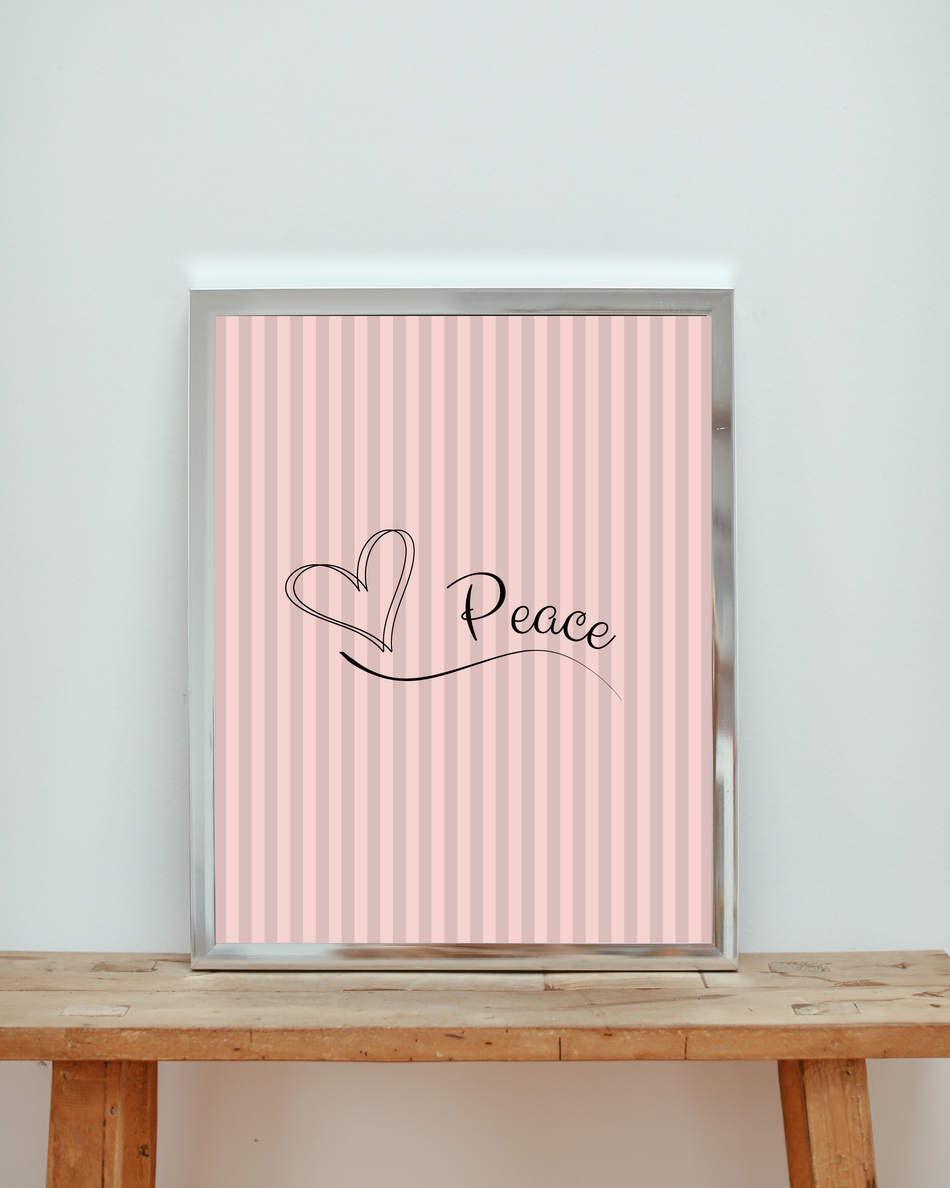 Canvas art print with 'Peace' and heart design on a light pink striped background