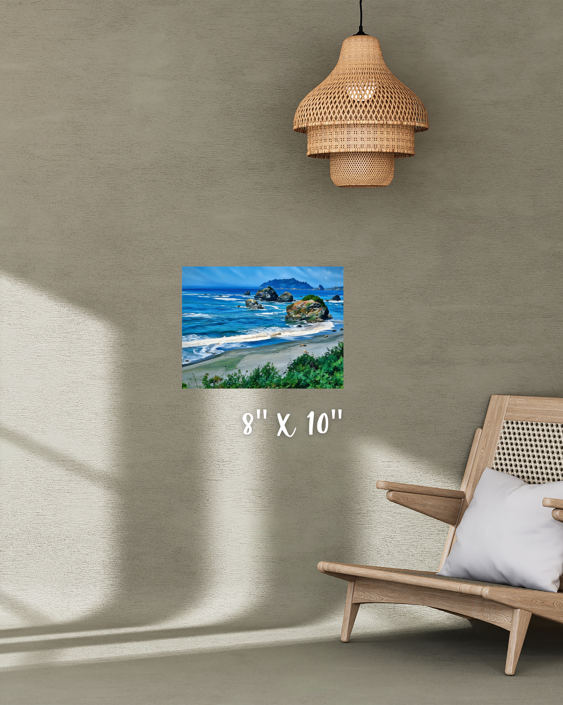 Beach scene print on a wall with earthy decor - a wooden chair and woven pendant light.