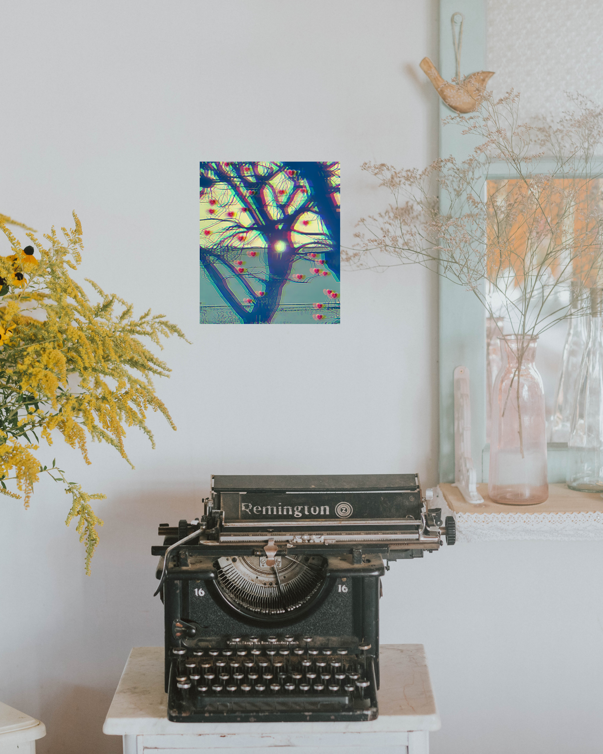 Original print art with chromatic hue blue base and winter tree growing love hearts in a California chic boho style room