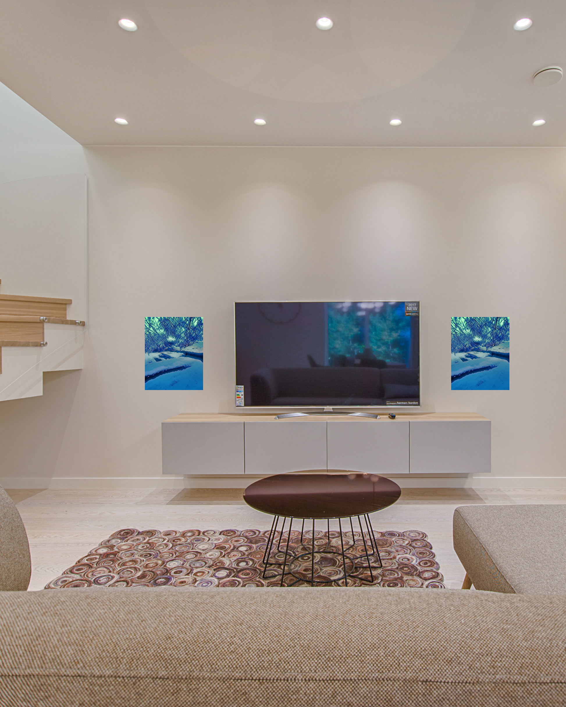 contemporary sunken living room with sleek furniture and original winter blue frozen creekbed canvas artwork