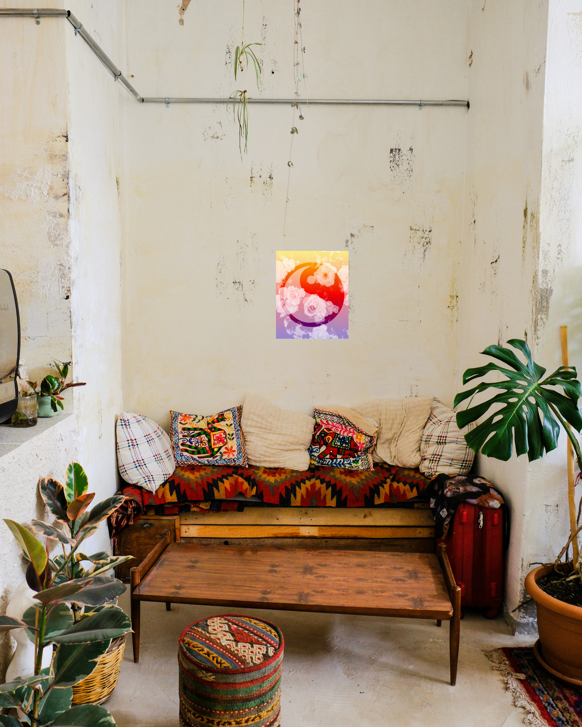 colorful boho style living room with live plants and original floral art print with ying yang overlaly